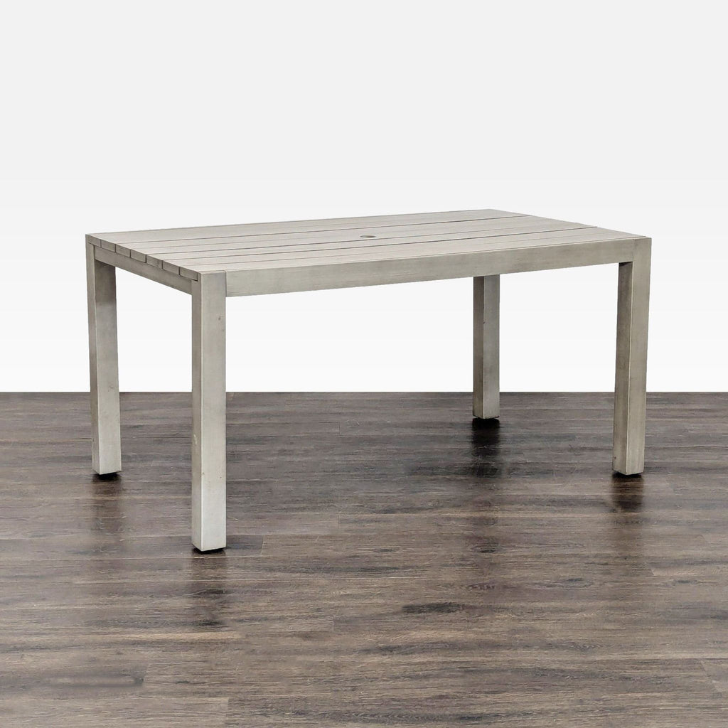 CB2 table in the Tables category, modern light grey finish, slatted design, suitable for indoor/outdoor use.
