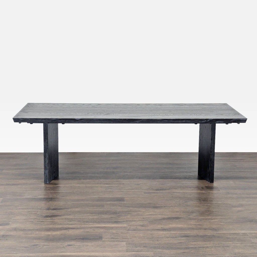 Williams Sonoma oak dining table with sculpted v-shaped legs and an extendable design up to 132 inches.  