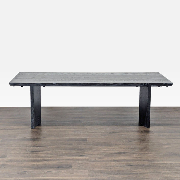 Williams Sonoma oak dining table with sculpted v-shaped legs and an extendable design up to 132 inches.  