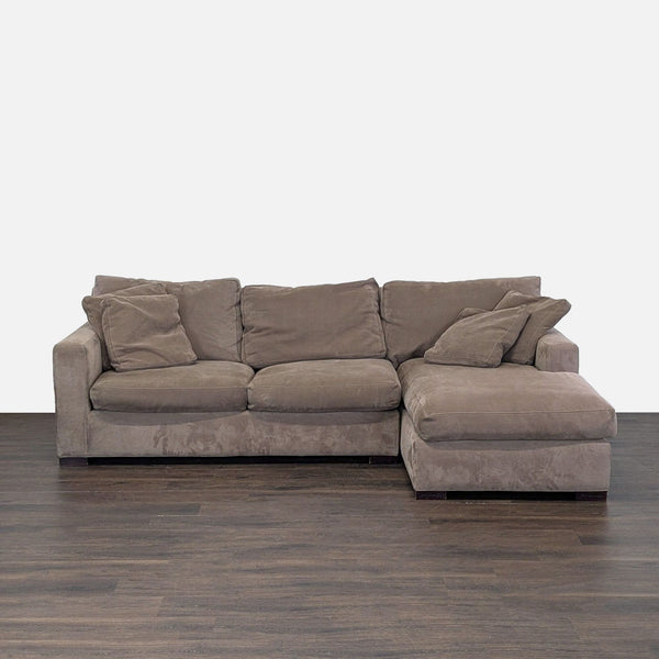 1. Front view of a Crate & Barrel sectional with soft microfiber fabric, spacious chaise, and matching cushions.
