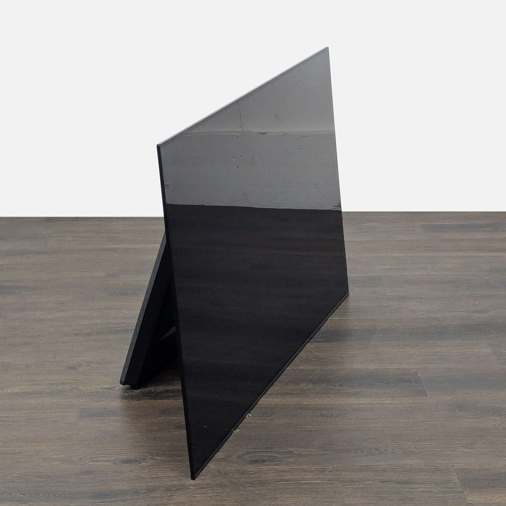 Side view of a Sony 55-inch 4K Smart TV, showcasing its slim profile and sleek appearance for any living room.