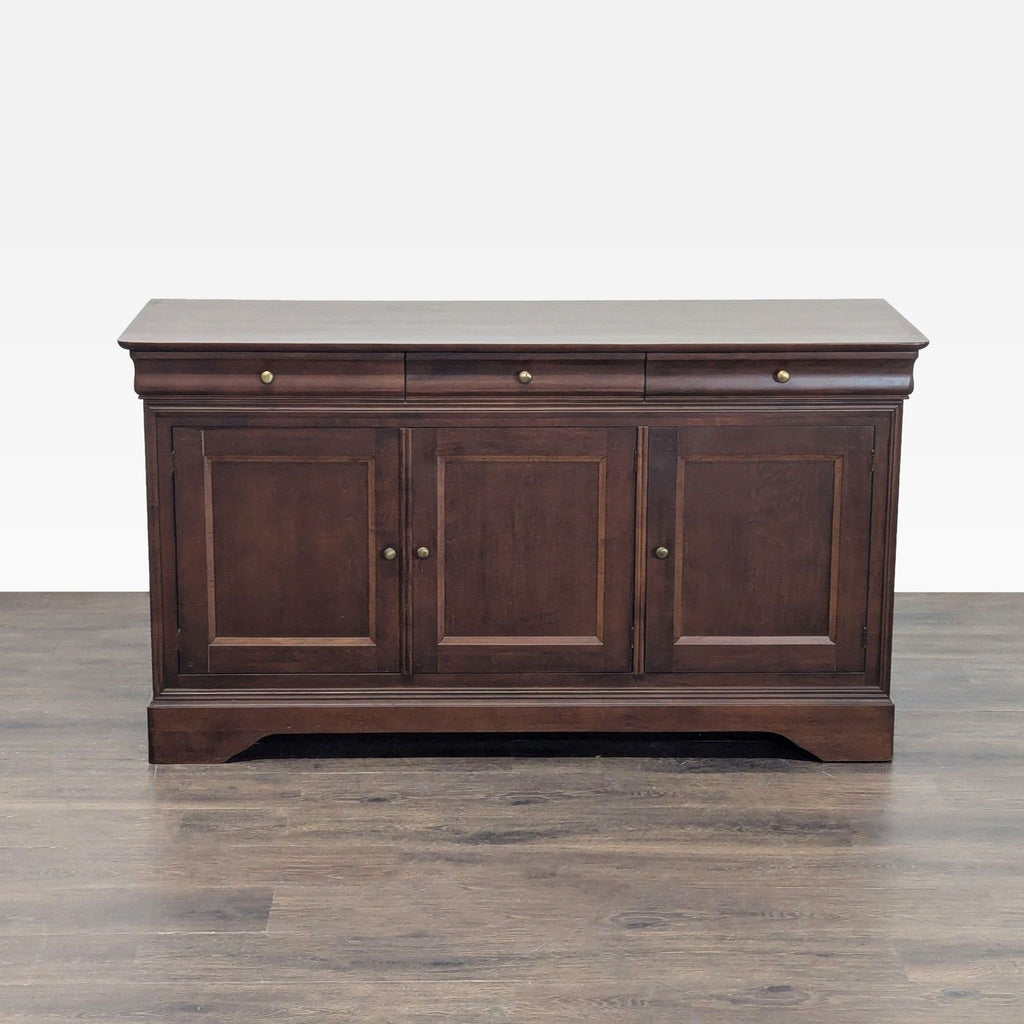 Elegant wooden sideboard with three drawers and three doors, each concealing a shelf, by HPL Division of Sherman Inc.