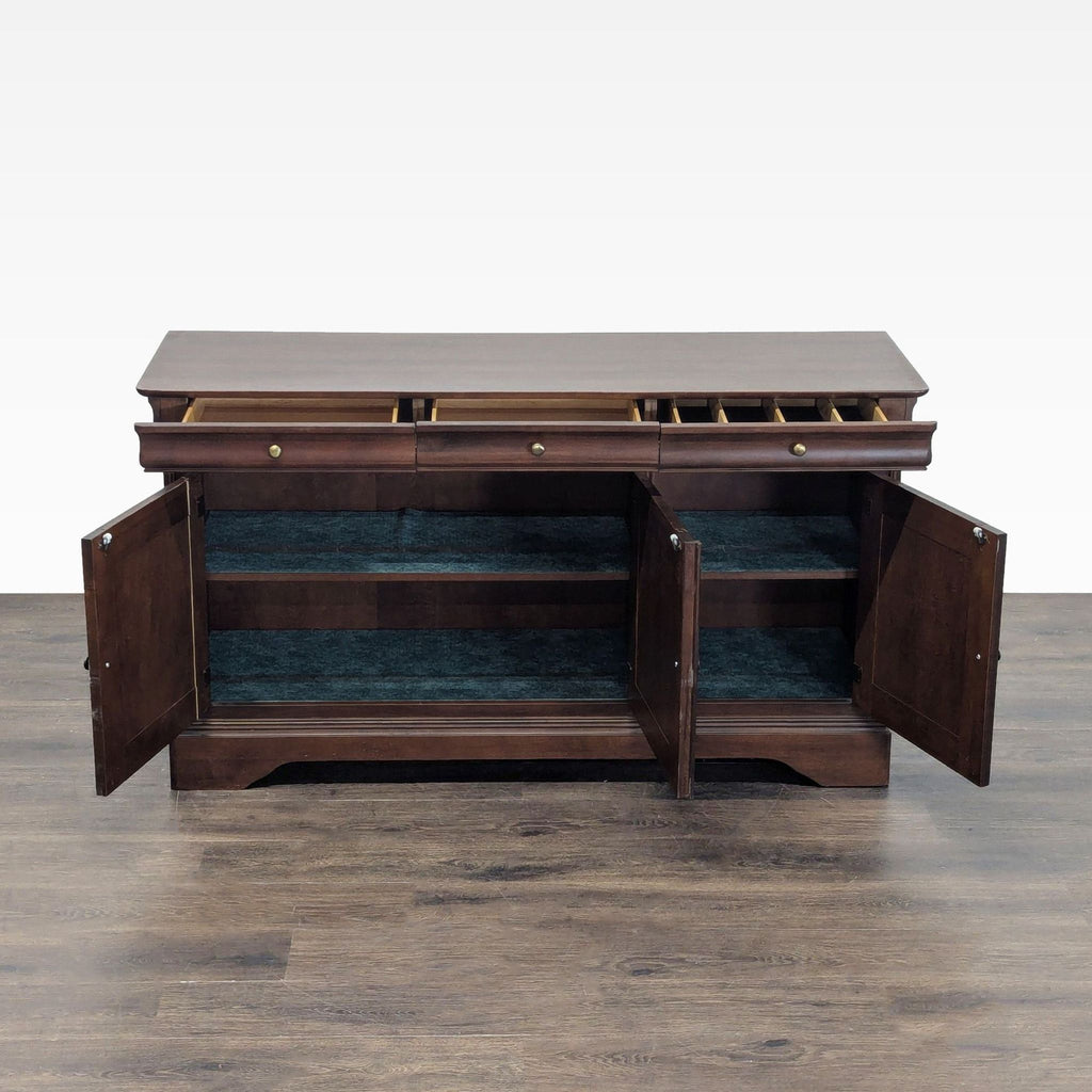 Solid wood and fine veneer credenza featuring divided silverware storage, swing doors, and ample shelving for organization.