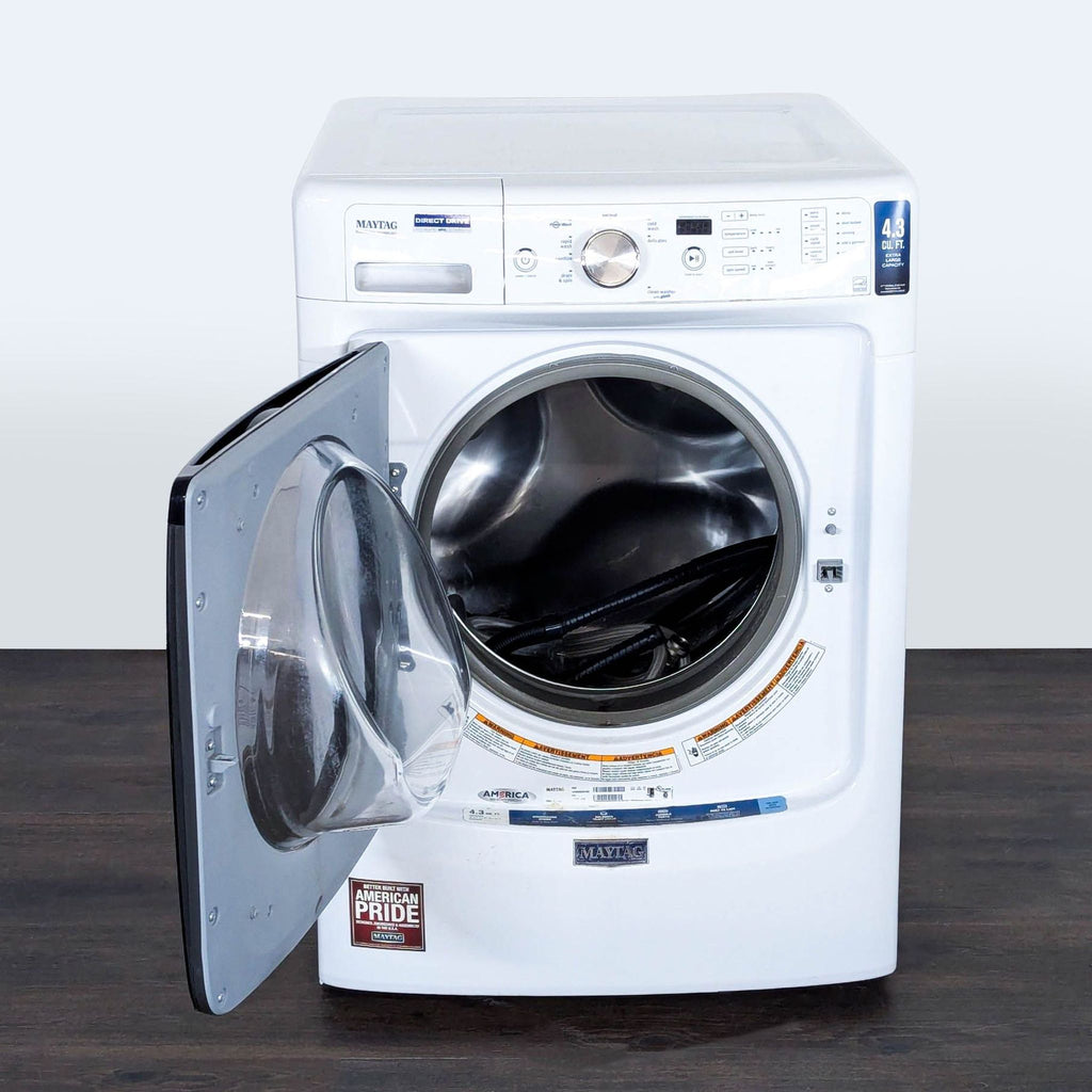 Spacious Maytag washer/dryer, front loading, easy controls, stainless steel drum, reliable, and excellent condition.