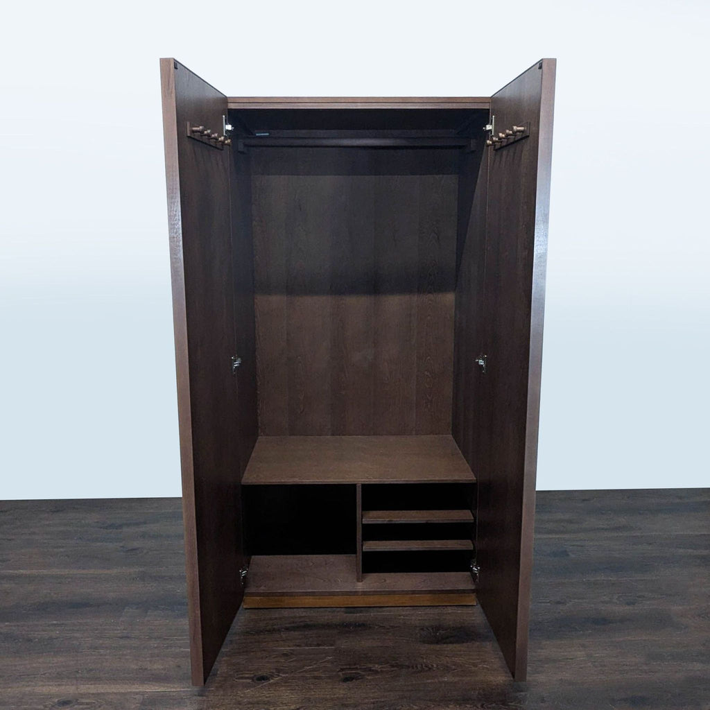 Modern CB2 cabinet featuring a hanging rod, shelf, and multiple cubbies for organizing clothes or items.