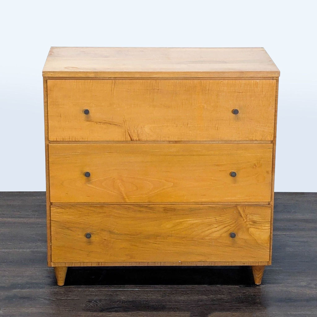 1. Mid-century modern dresser with three spacious drawers, round metal knobs, and a warm natural wood finish.