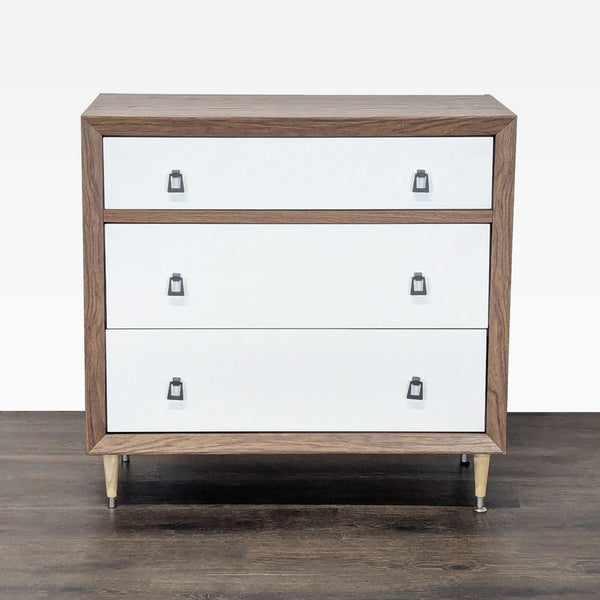 Baxton Studio walnut and white dresser with three drawers, sleek handles, and modern tapered legs.