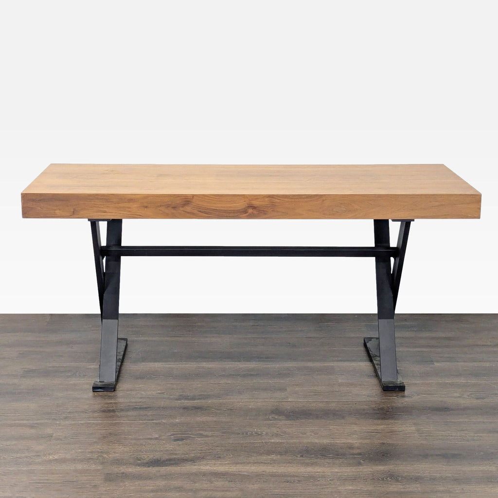 1. Moe's desk with a solid wood top and black metal legs, showcasing an industrial, modern design for any office.