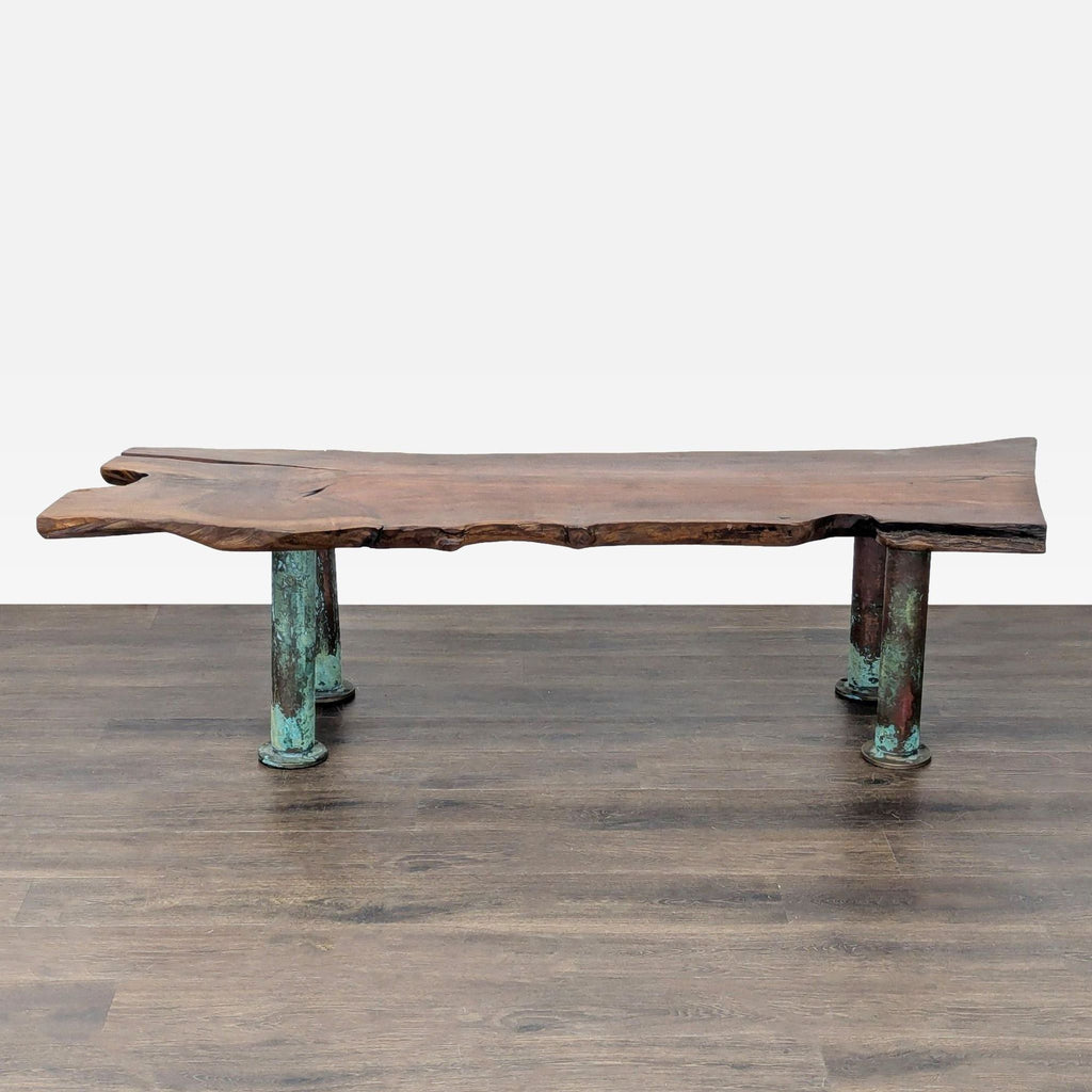 Copper coffee table legs with a blue patina finish from oxidation, adding a unique touch.  