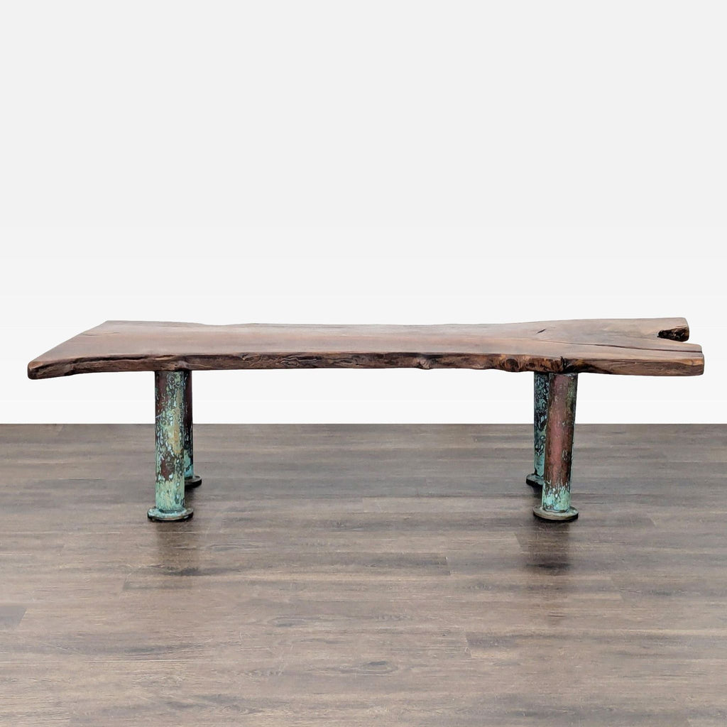 Coffee table featuring blue-toned patina legs made from oxidized copper for a striking look.
