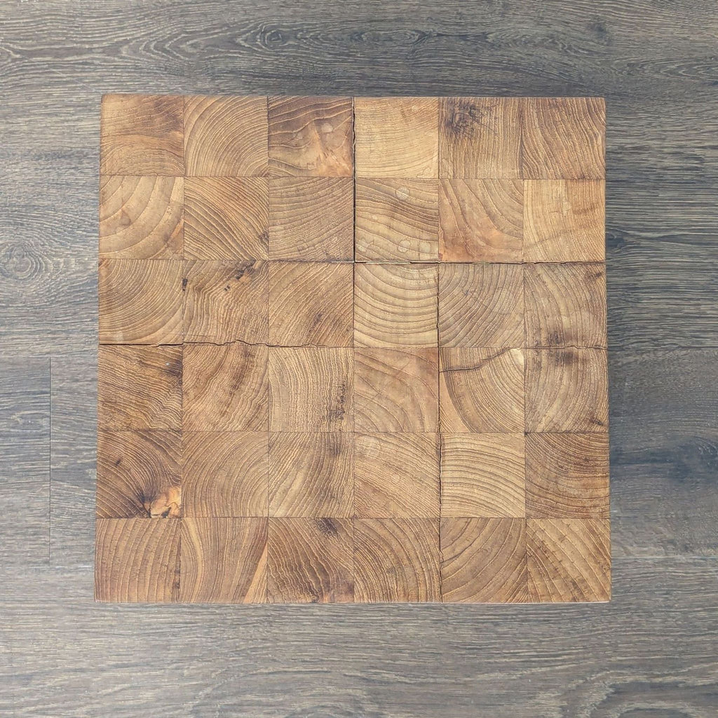 3. Top-down view of a square side table, highlighting the mosaic effect of joined wooden blocks and their unique grain.
