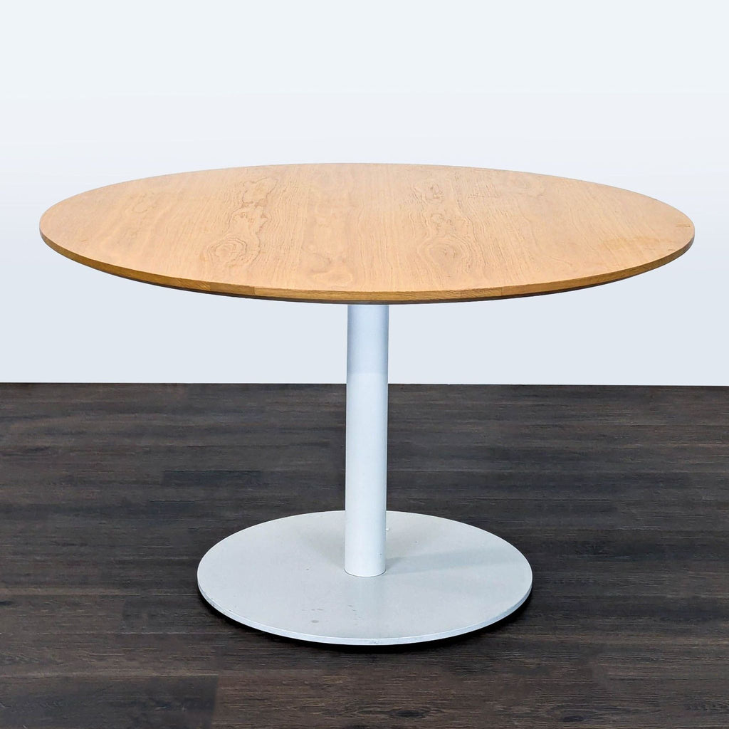 Contemporary Blu Dot table and chairs set with fabric seats, black legs, and a sturdy round wood tabletop.