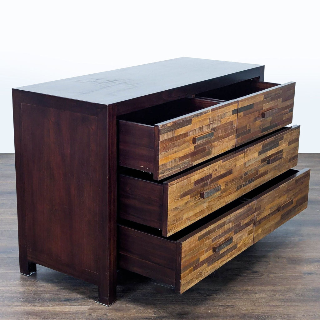 Six-drawer rustic dresser from Environment Furniture featuring a sturdy dark finish and unique patchwork wood design.  