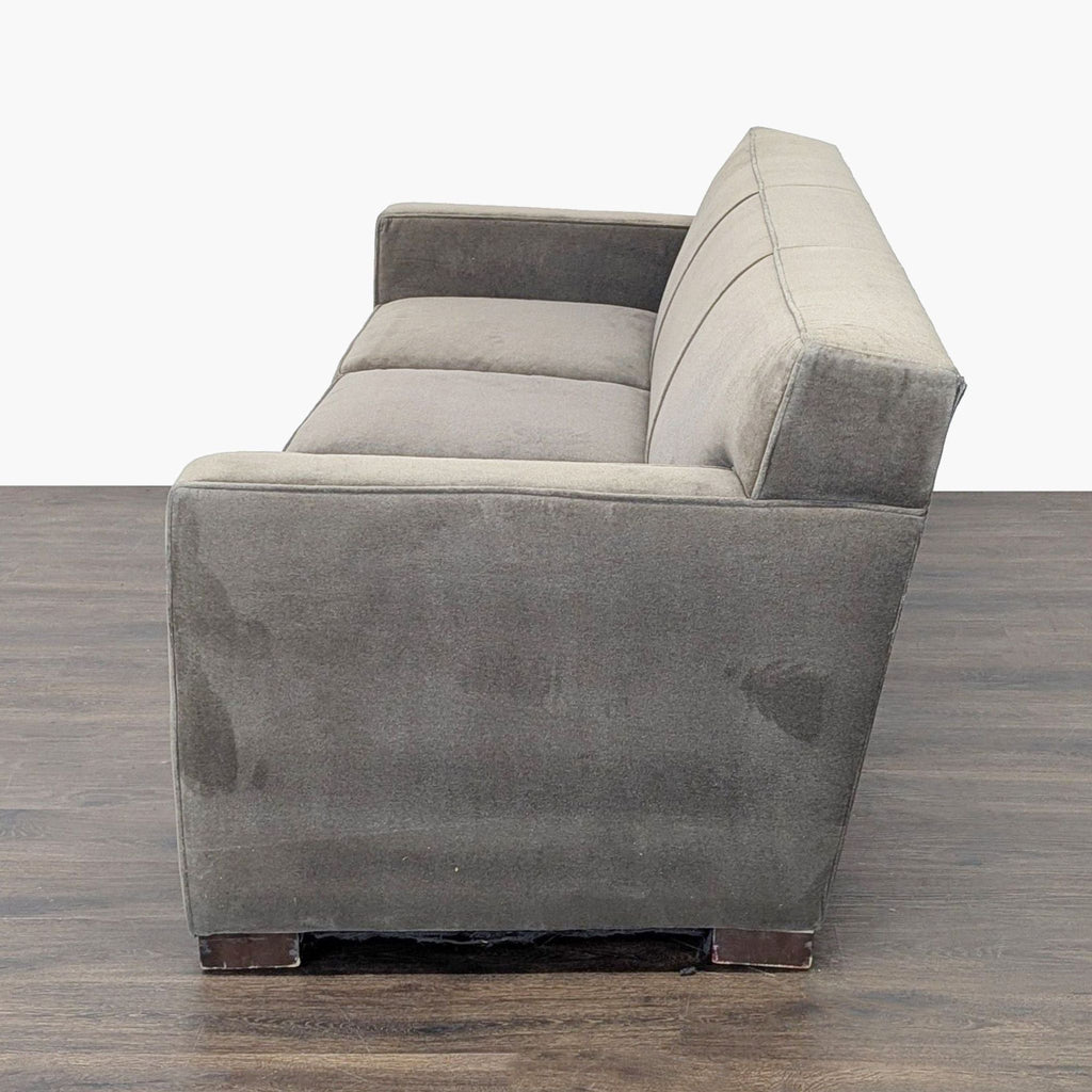 Modern three-seat Room & Board sofa in gray fabric, ideal for relaxing or hosting guests in any contemporary space.