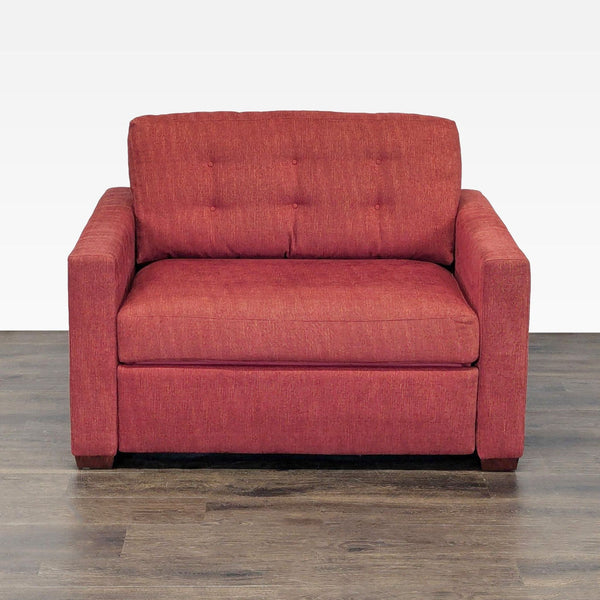 Red Crate & Barrel sleeper sofa with modern design, plush cushions, and convertible pull-out bed feature.