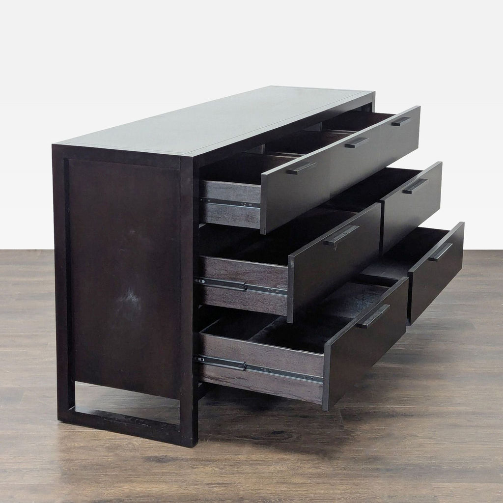Dark wood Casana dresser featuring a contemporary style, spacious storage, and simple, stylish handles.