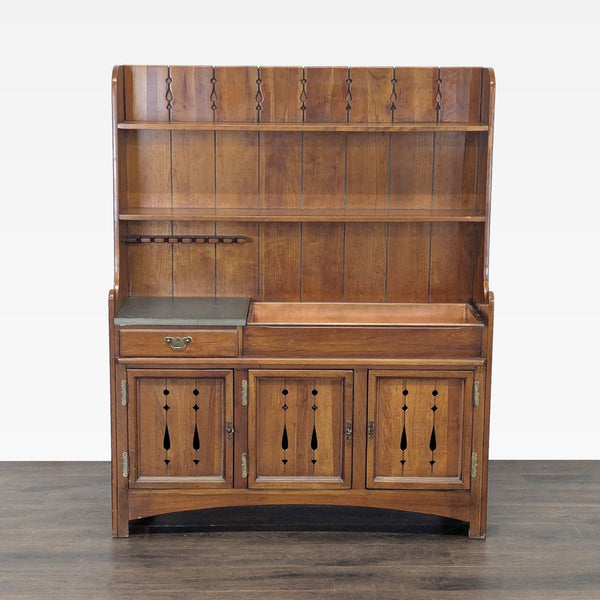 Country-style hutch with plank design, cut-out details, single drawer, shelves, and glassware storage.