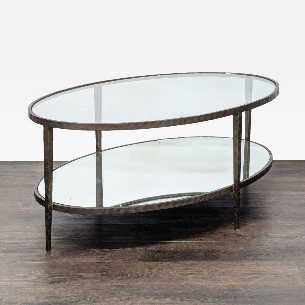 2. Elegant coffee table with a textured, hammered wrought iron base supporting the tabletop.