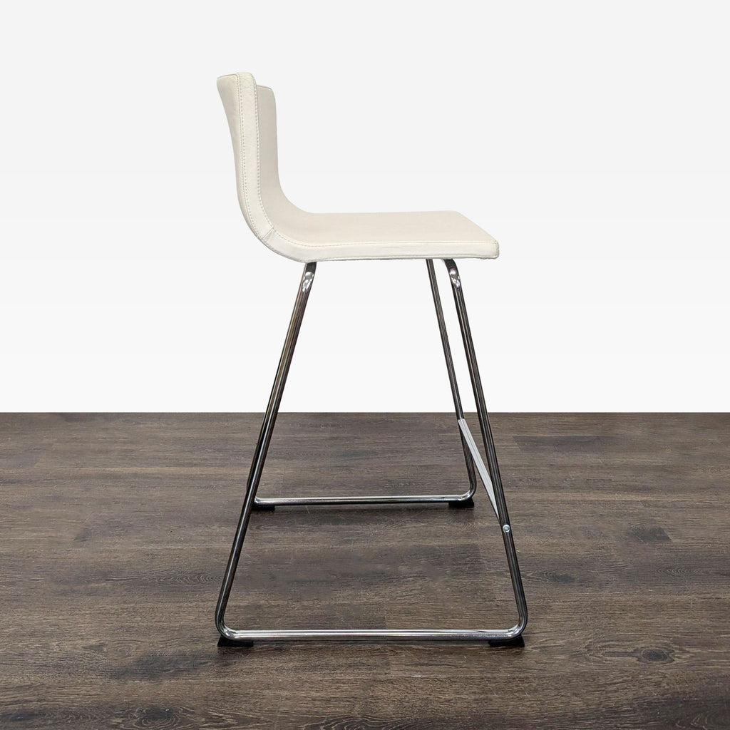 Ikea bench with soft leather upholstery and shiny chrome legs, Ola Wihlborg design.