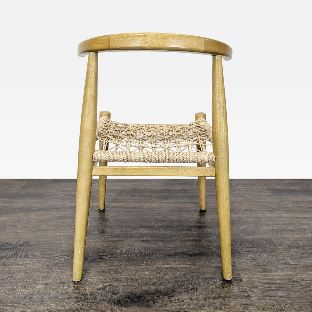 2. Dining chair with natural wood frame and woven seat, rear view highlighting curved top rail.  