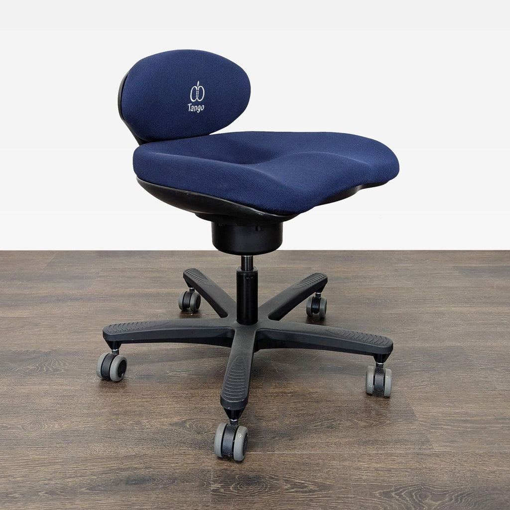 2. Side angle of the CoreChair Tango ergonomic chair showing adjustable backrest, blue seat, and five-wheel base.