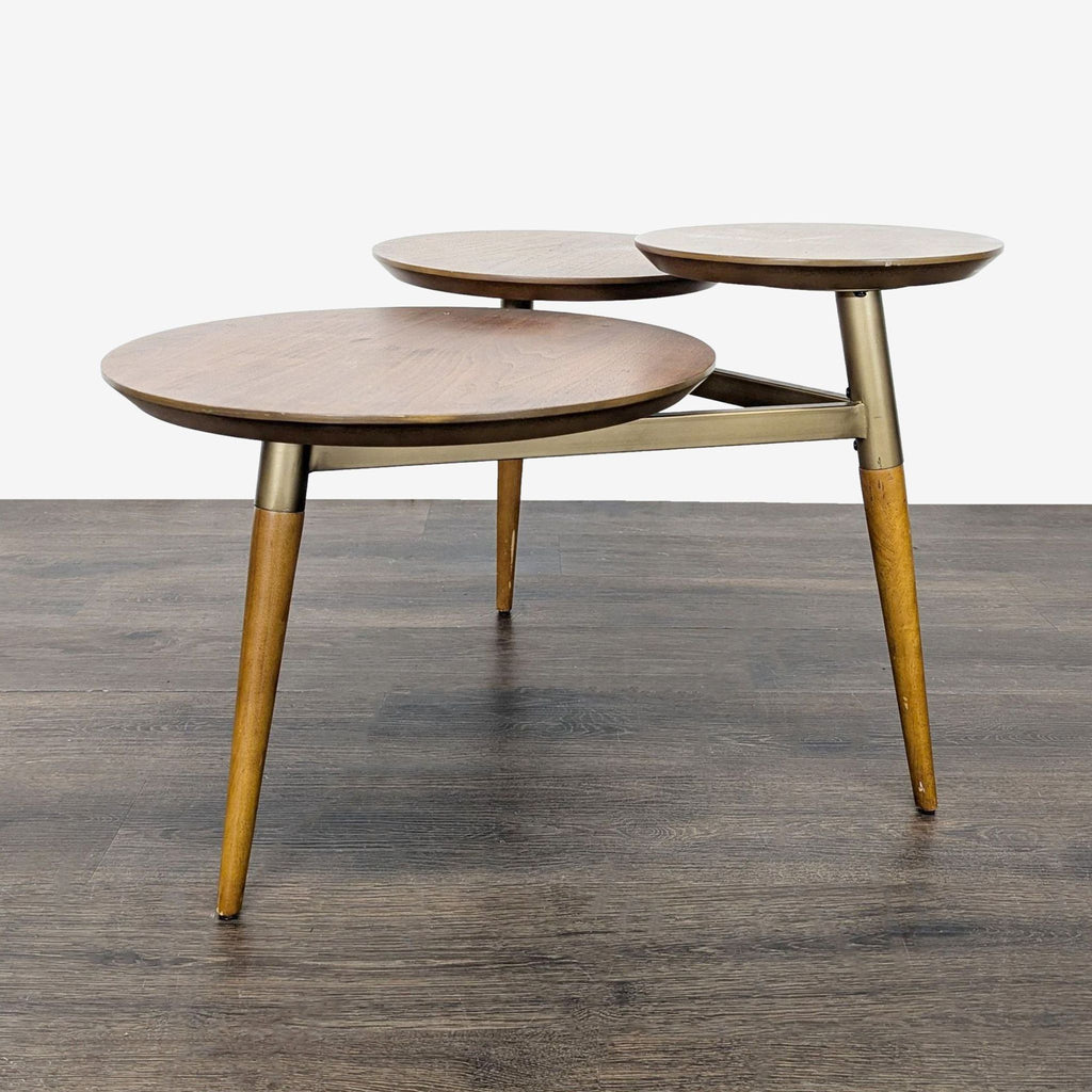 Mid-century style end table by West Elm with walnut shelves and an antique brass metal frame.