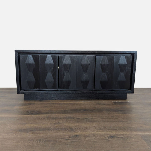 West Elm mango wood entertainment center with textured cabinet doors and shelving for media storage.  