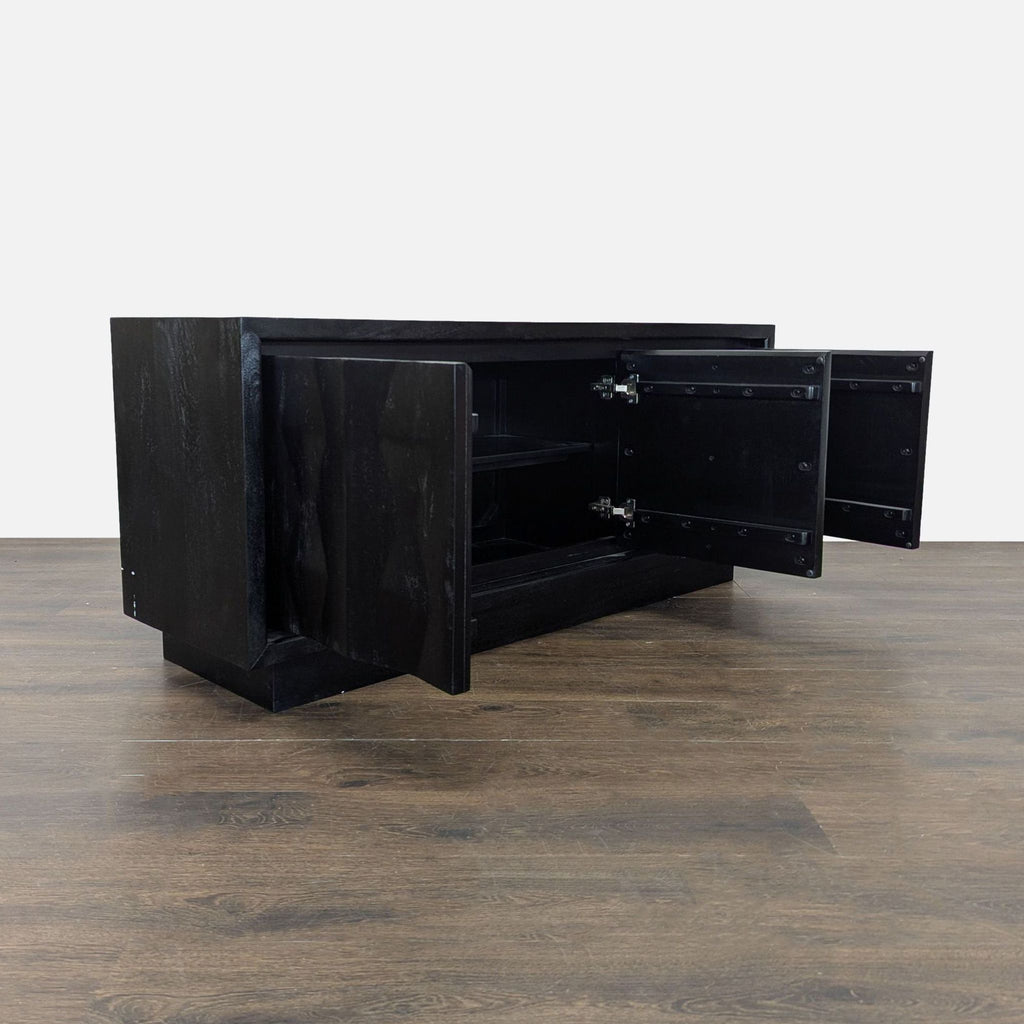 Entertainment center made of mango wood featuring textured doors, wiring cut-outs, and internal shelves.  
