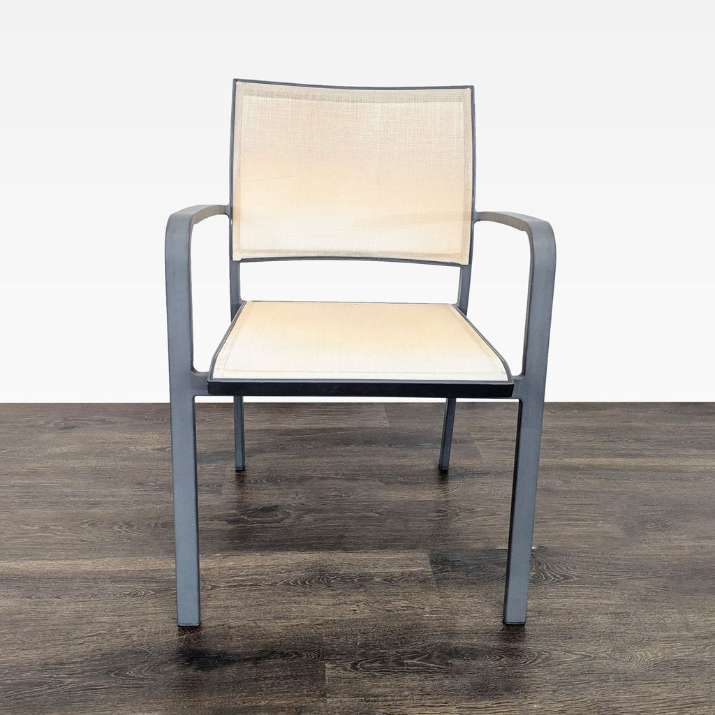 3. Front view of a beige mesh chair with sturdy metal frame, showcasing its simple and modern design.