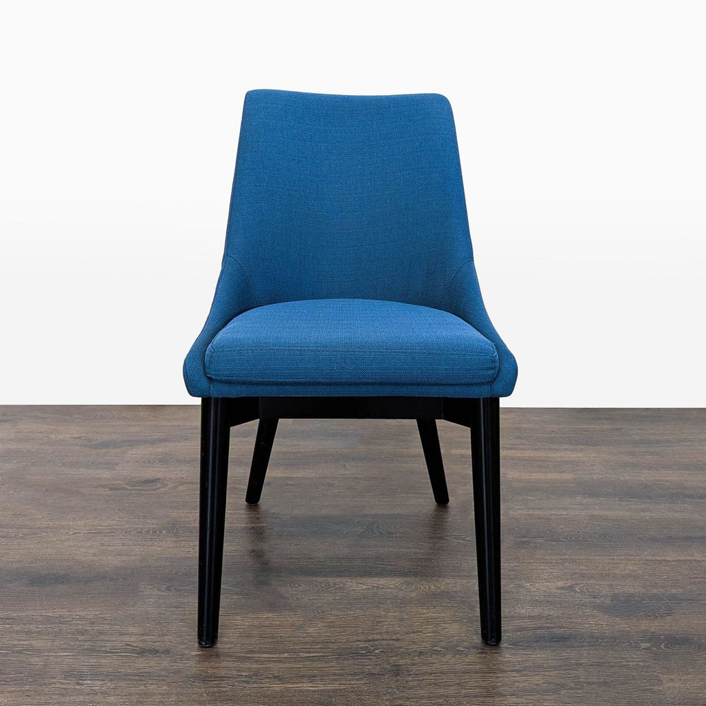 1. Front view of a Modway dining chair with blue upholstery and black wooden legs on a wooden floor.