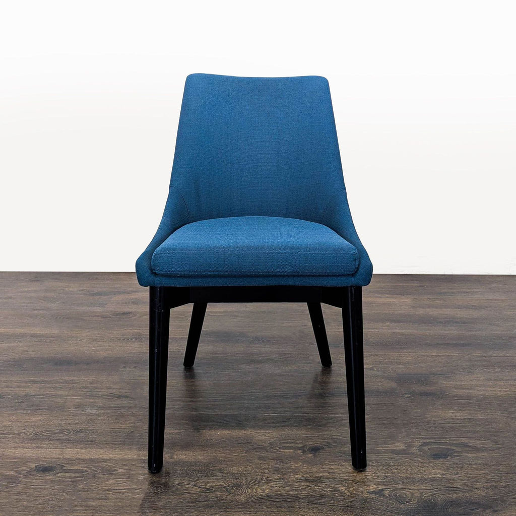 1. Front view of a Modway blue upholstered dining chair with black legs, placed on a wooden floor.