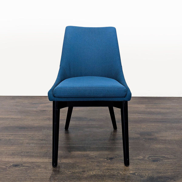 1. Front view of a Modway blue upholstered dining chair with black legs, placed on a wooden floor.