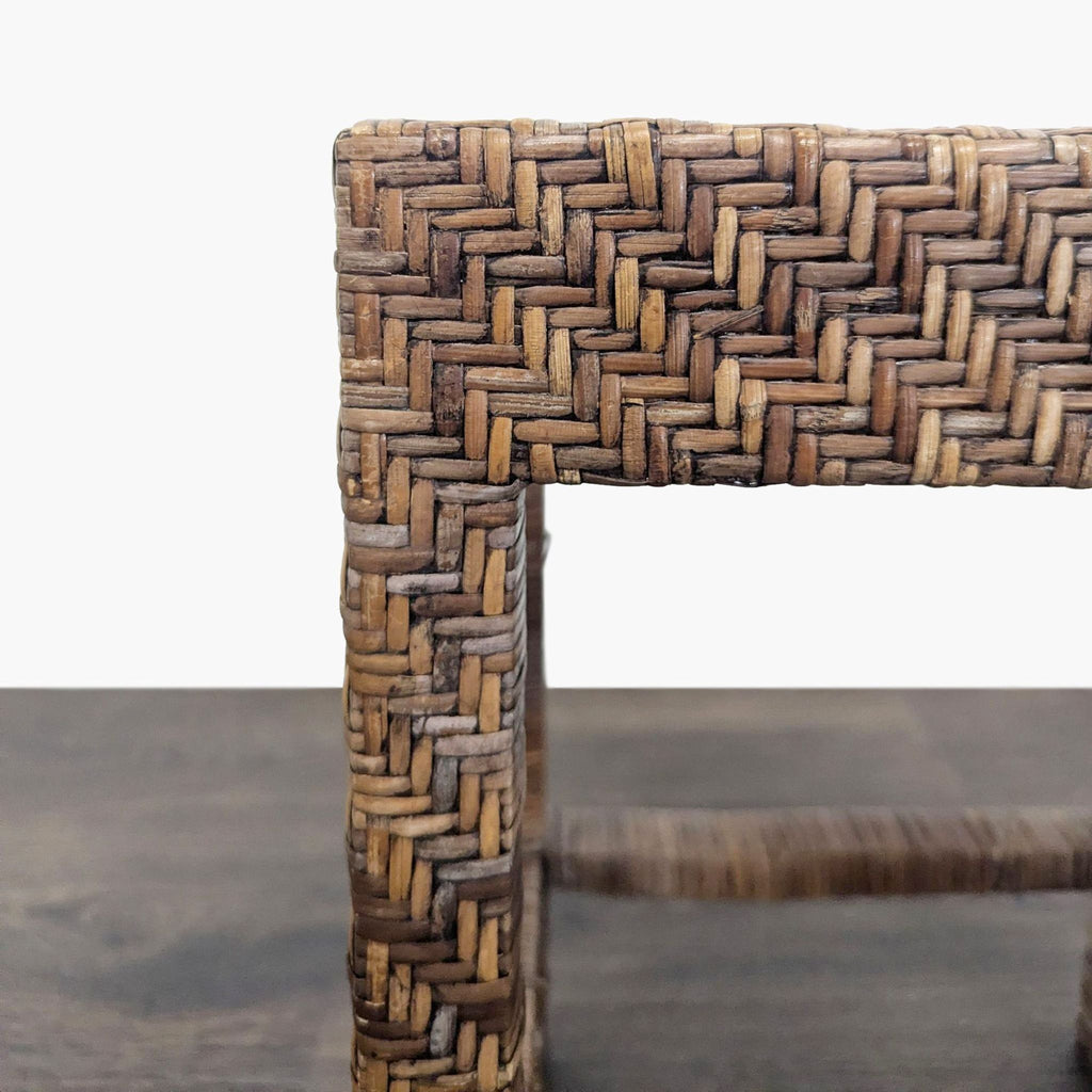 2. Close-up of a woven rattan stool corner, highlighting the detailed chevron weaving and natural brown tones.