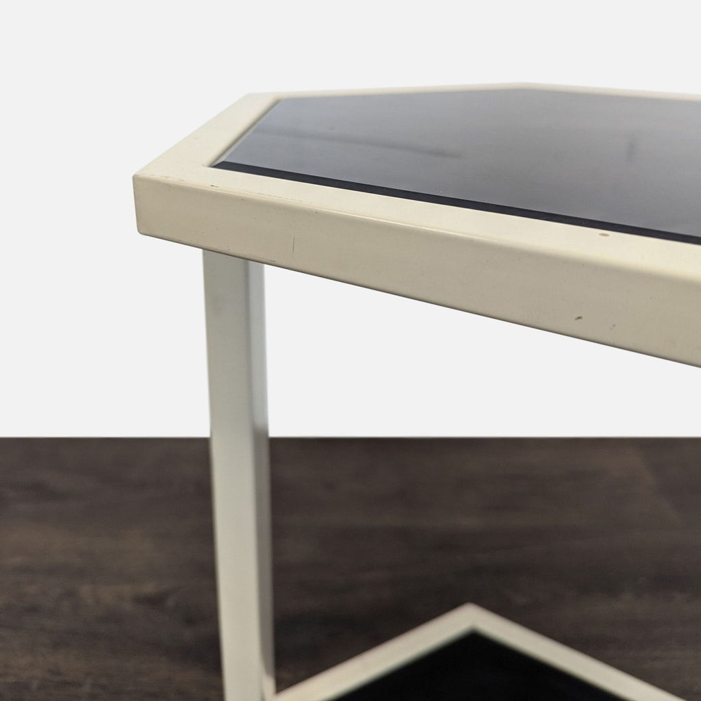 Contemporary Nate Berkus side table with a white metal structure and black glass tabletop and base.