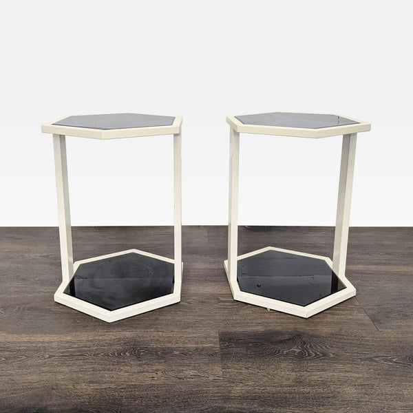 Sleek Nate Berkus side table with a white metal frame and black glass top, perfect for modern spaces.  