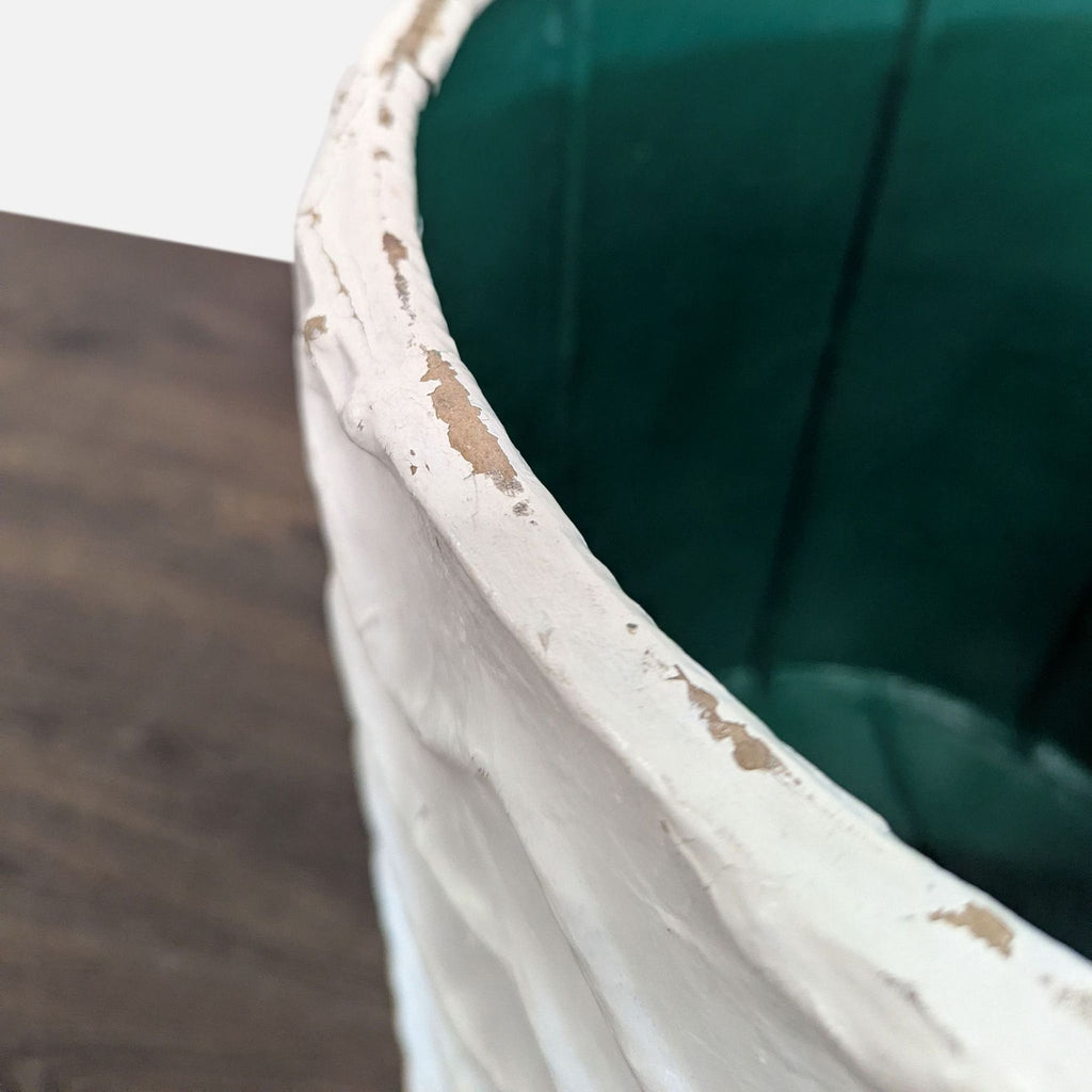 Decorative vase with a plaster finish, ideal as a stylish planter for interiors.