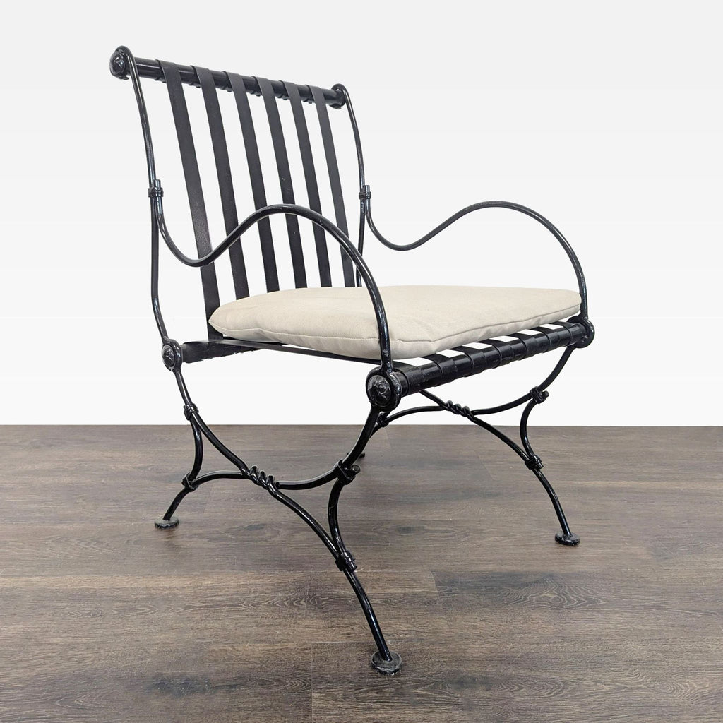 Modern lounge chair by Project 62 featuring a sturdy black frame, beige cushion, and gently curved arms for support.