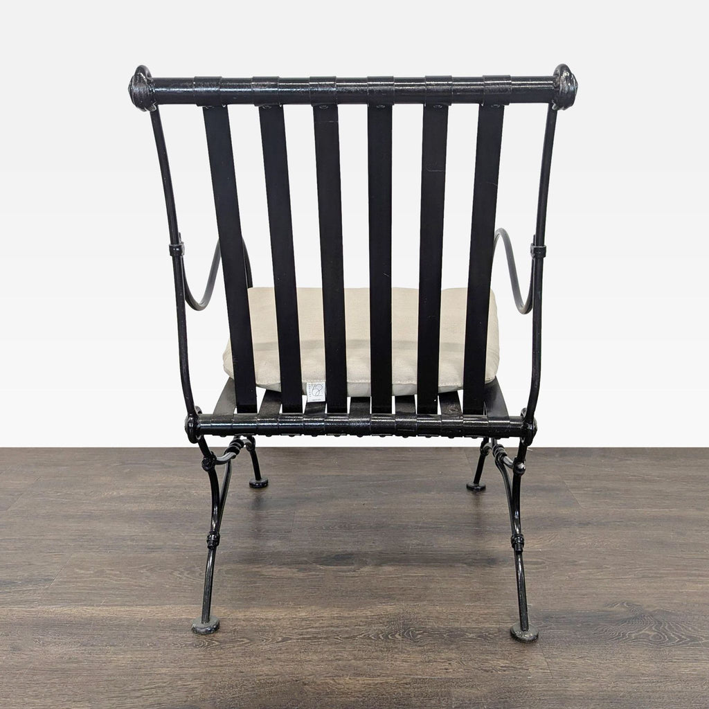 Contemporary black metal lounge chair from Project 62 with slatted design and a plush beige cushion for relaxation.