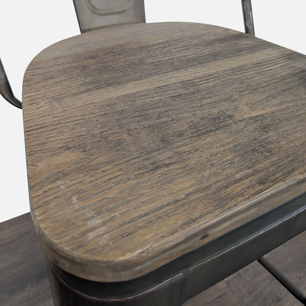 1. Close-up view of a wooden stool seat with a rustic finish and visible wood grain.