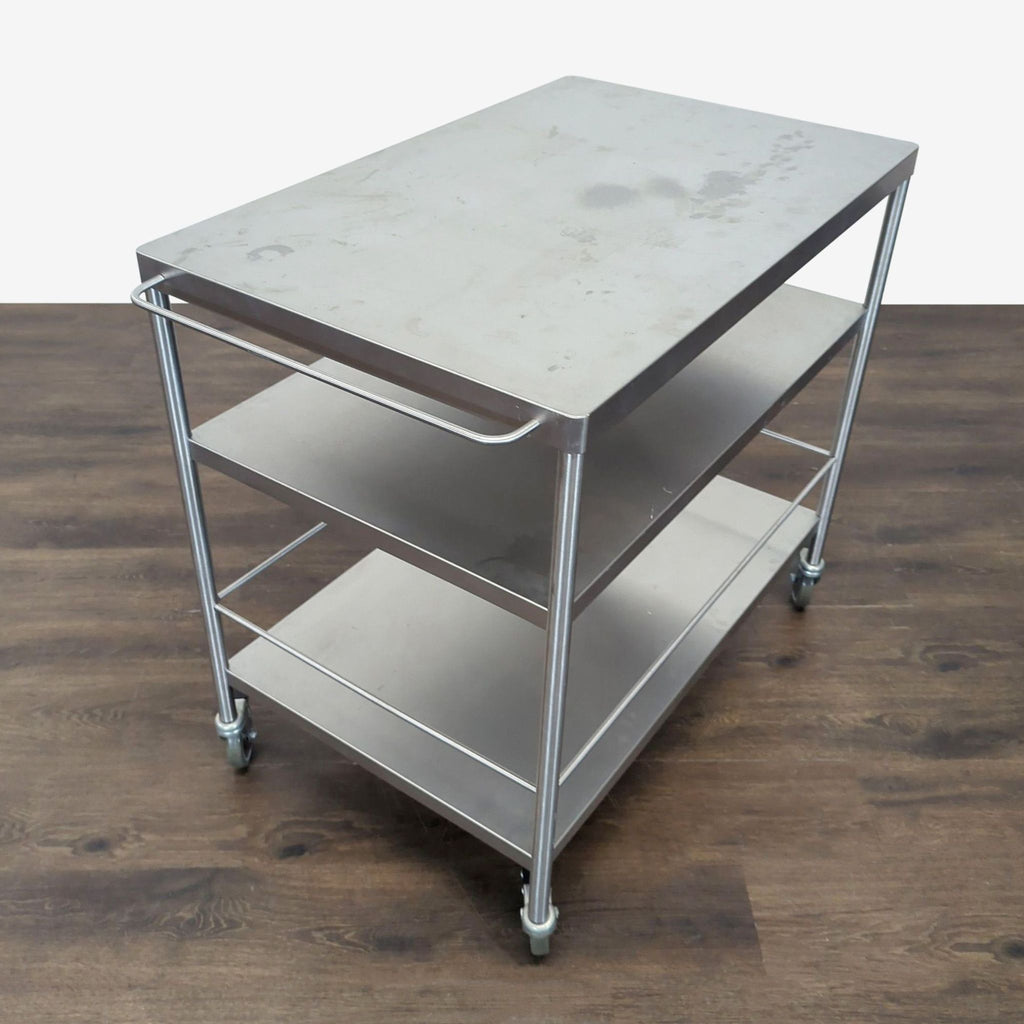 2. Mobile metal kitchen cart with three tiers and side handle, ideal for organizing cookware or tools.