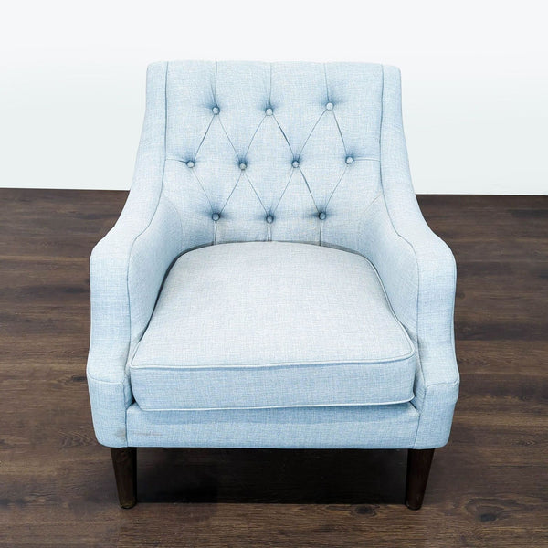 Light blue Madison Park lounge chair with tufted backrest, curved armrests, and dark wooden legs.