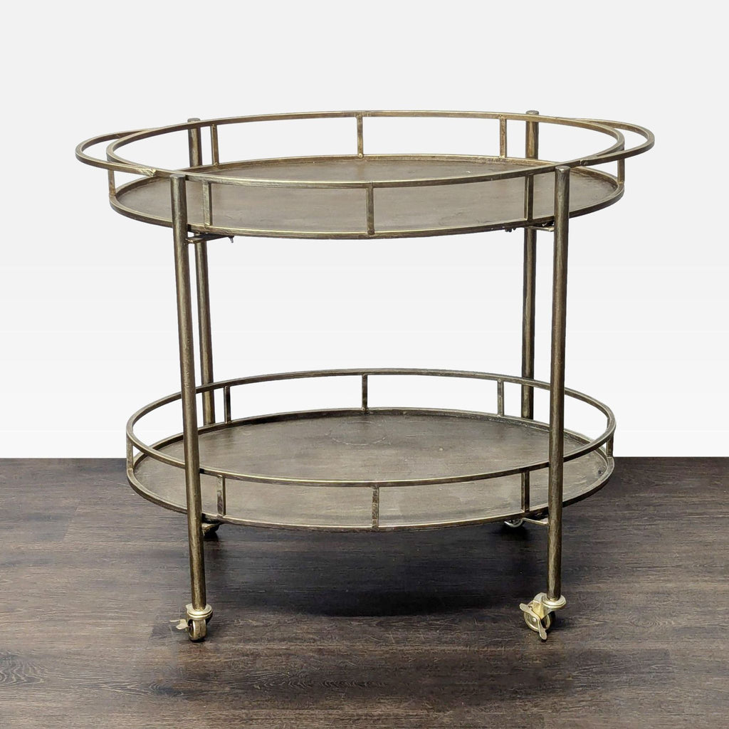 1. Round two-tiered metal serving cart with rails and casters, displayed on a dark wooden floor.