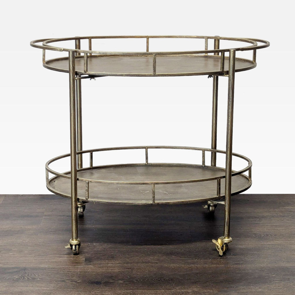 2. Vintage-inspired circular rolling cart with two shelves and open brass-tone frame on wheels.