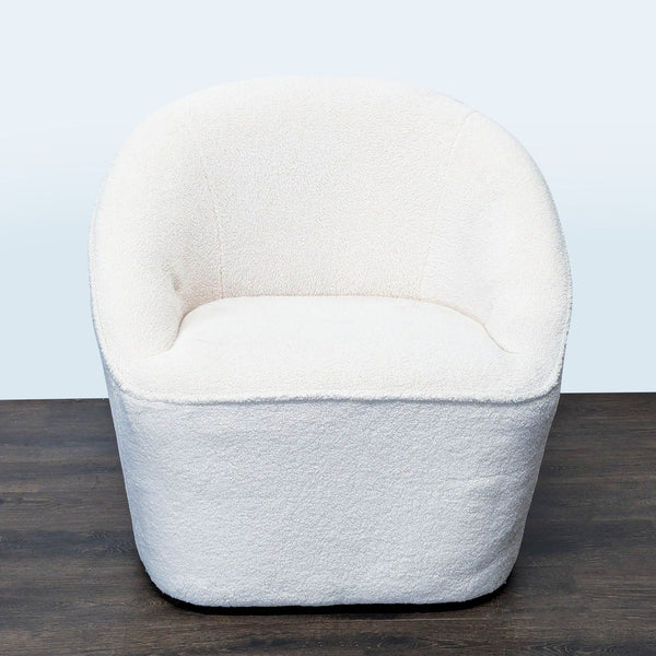 Eluxury swivel lounge chair with curved back and white boucle fabric, offering modern comfort and style.