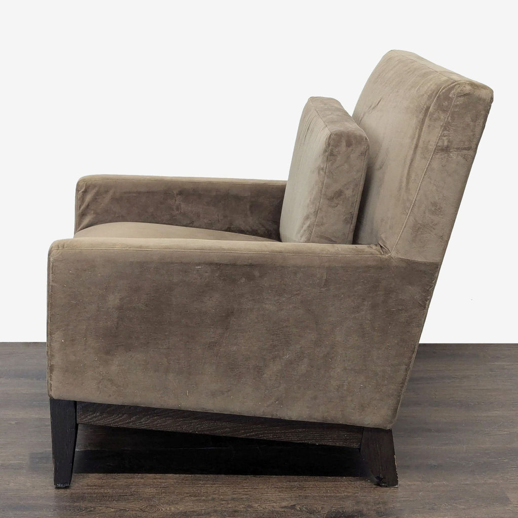 Contemporary lounge chair by West Elm, upholstered in brown with comfortable cushioning and minor wear.