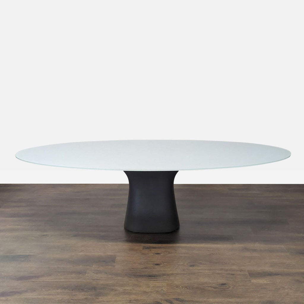 Oval frosted glass table with black base and eight dark grey velvet chairs, stylish dining set from Bontempi Casa / Gallotti&Radice.