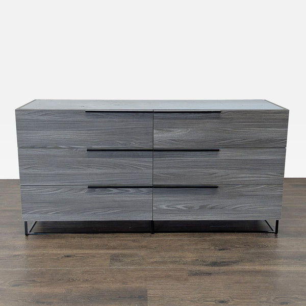 Sleek Modrest dresser in gray wood with black metal legs and six spacious drawers, perfect for modern bedrooms.