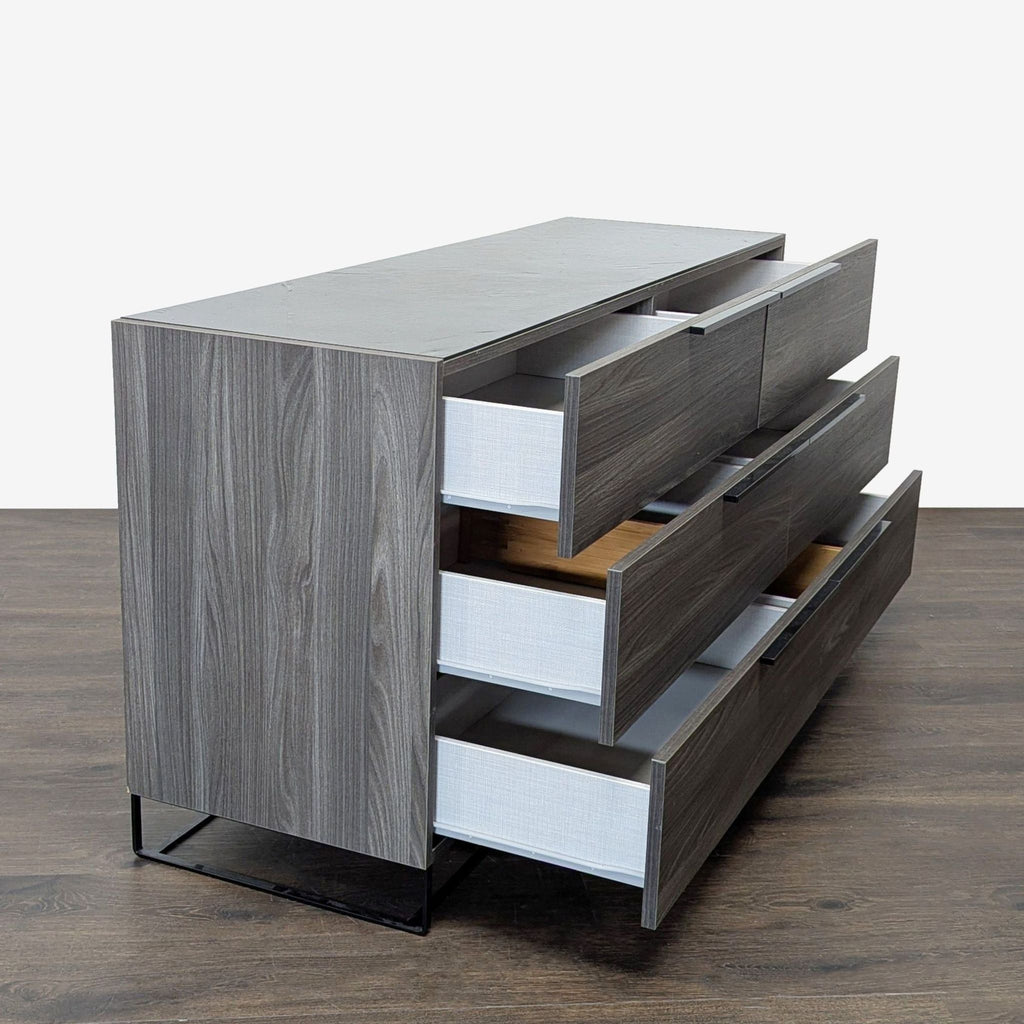 Modern gray wood dresser by Modrest, featuring six large drawers and sturdy black metal legs for stylish storage.