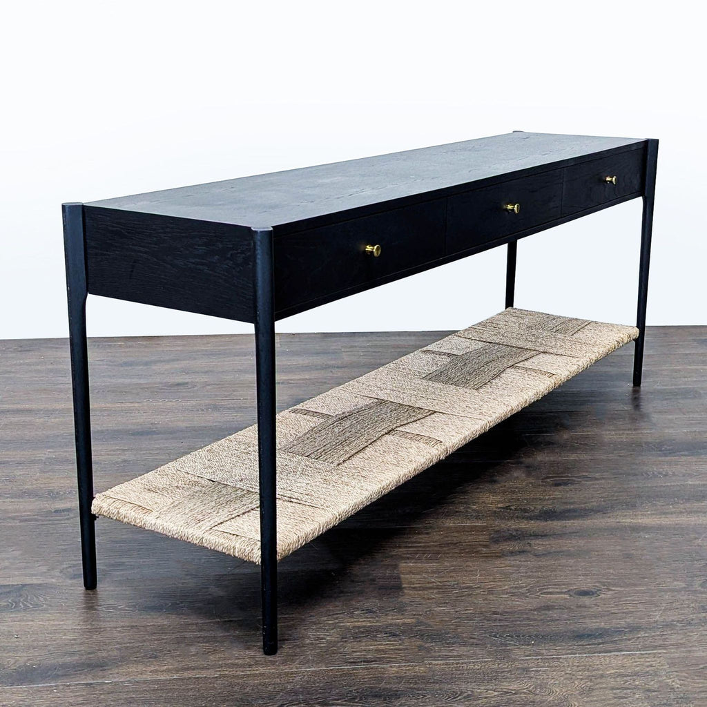 Three-drawer console table by Arhaus, featuring brass hardware and a lower rope shelf.