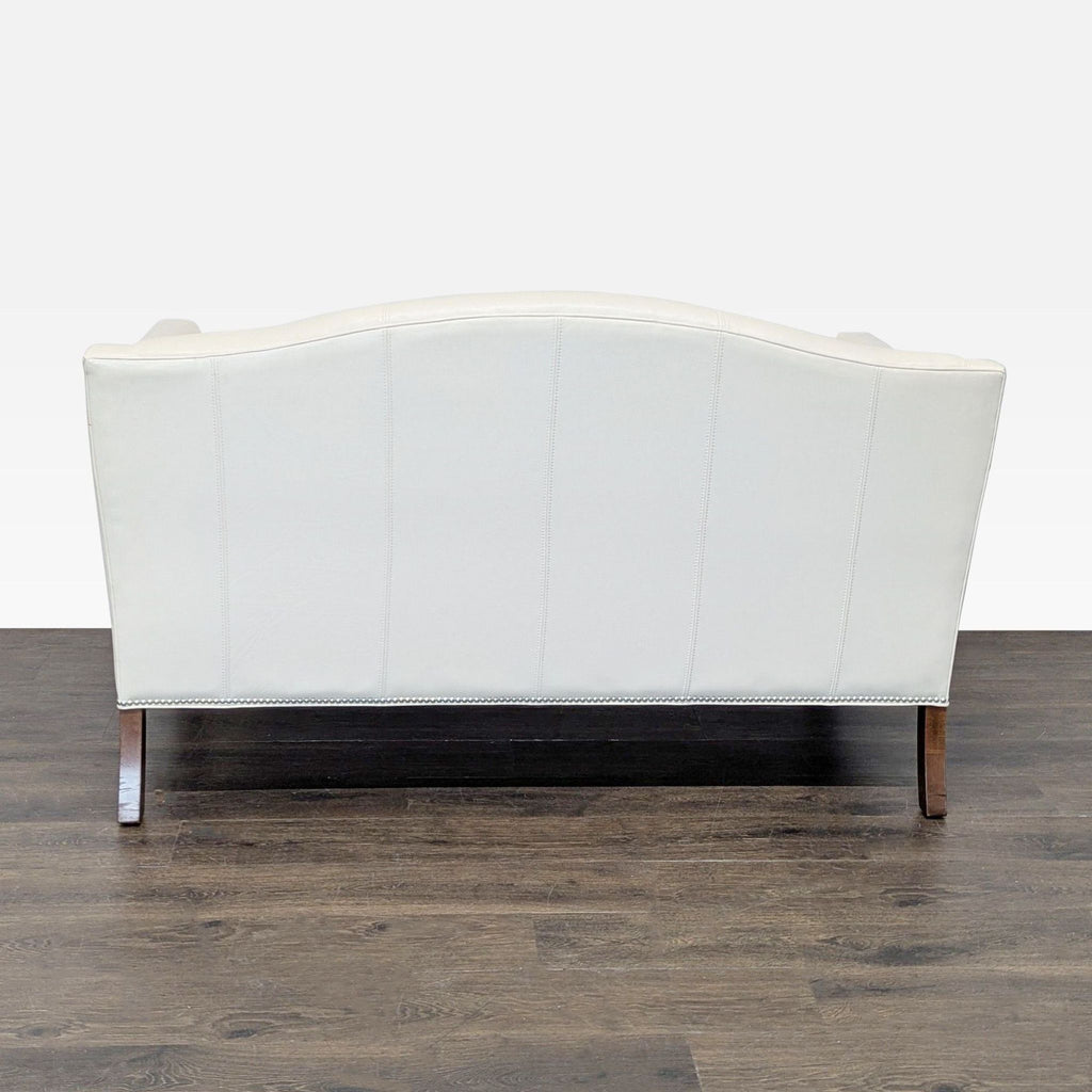 Ethan Allen Cream Leather Loveseat with Wood Legs